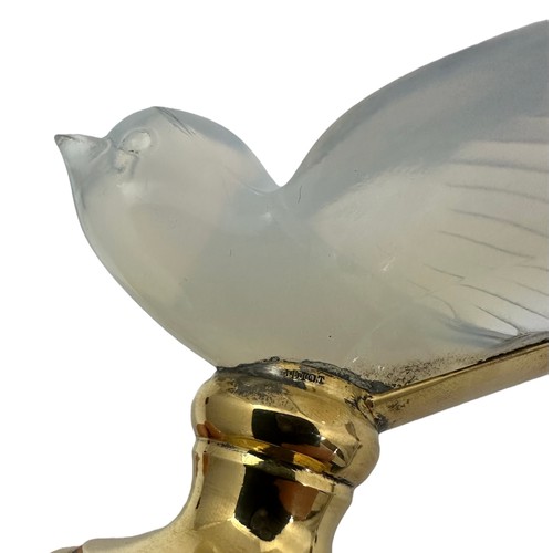 211 - A pair of glass models of swallows raised on French silver gilt stands, stamped Odiot. Approx. 2 1/4... 