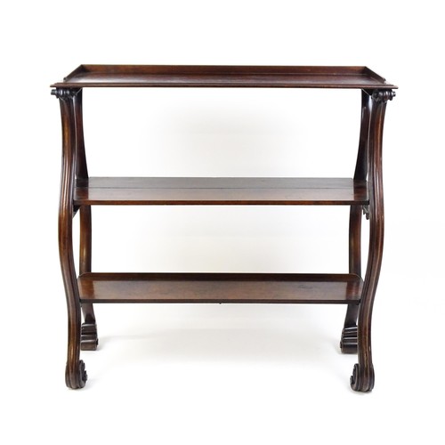 1712 - A late 18thC / early 19thC rosewood buffet / etagere with three tiers raised on four S formed moulde... 