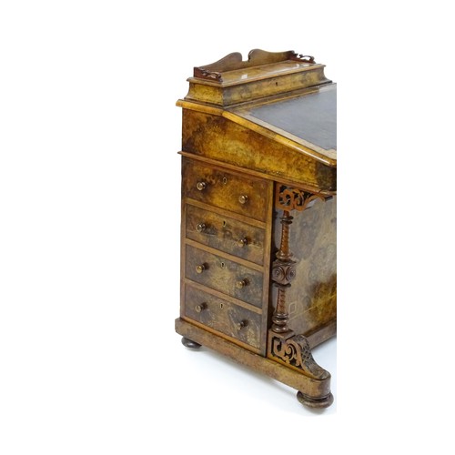 1675 - A mid / late 19thC burr walnut Davenport surmounted by a fitted writing box above a leather slope, t... 