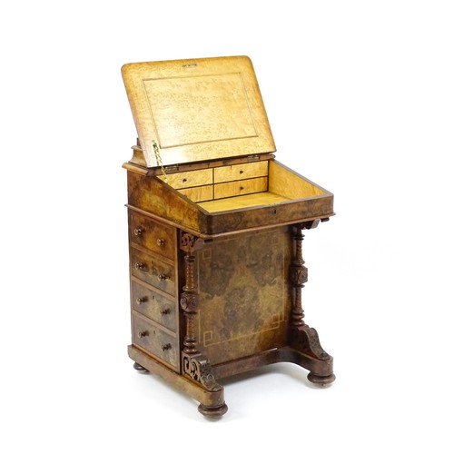 1675 - A mid / late 19thC burr walnut Davenport surmounted by a fitted writing box above a leather slope, t... 