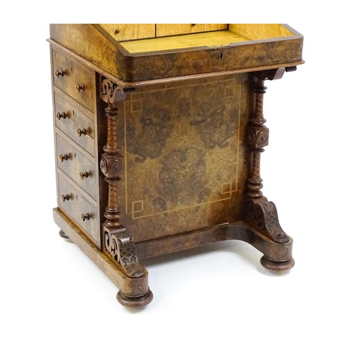 1675 - A mid / late 19thC burr walnut Davenport surmounted by a fitted writing box above a leather slope, t... 