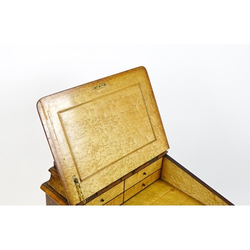 1675 - A mid / late 19thC burr walnut Davenport surmounted by a fitted writing box above a leather slope, t... 