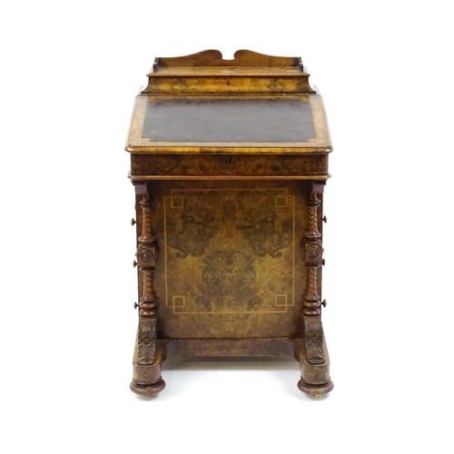 1675 - A mid / late 19thC burr walnut Davenport surmounted by a fitted writing box above a leather slope, t... 