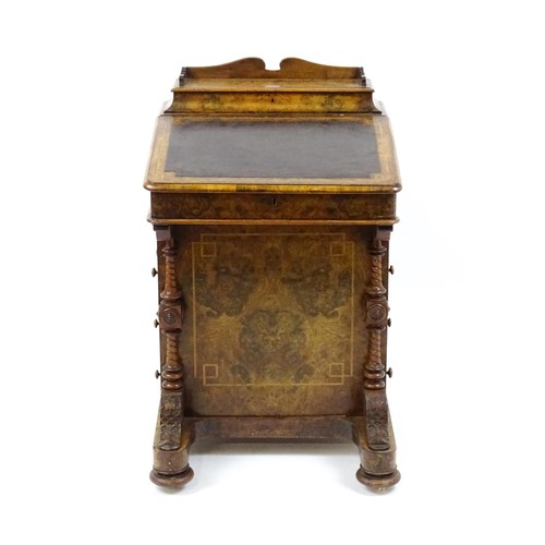 1675 - A mid / late 19thC burr walnut Davenport surmounted by a fitted writing box above a leather slope, t... 