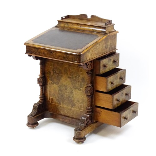 1675 - A mid / late 19thC burr walnut Davenport surmounted by a fitted writing box above a leather slope, t... 