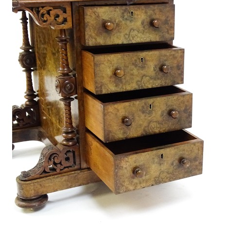 1675 - A mid / late 19thC burr walnut Davenport surmounted by a fitted writing box above a leather slope, t... 