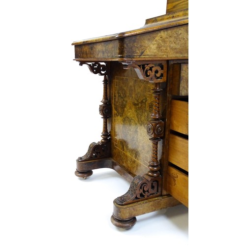 1675 - A mid / late 19thC burr walnut Davenport surmounted by a fitted writing box above a leather slope, t... 