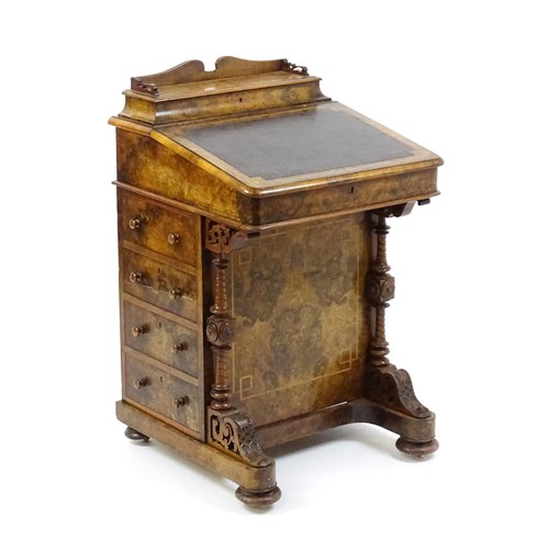 1675 - A mid / late 19thC burr walnut Davenport surmounted by a fitted writing box above a leather slope, t... 