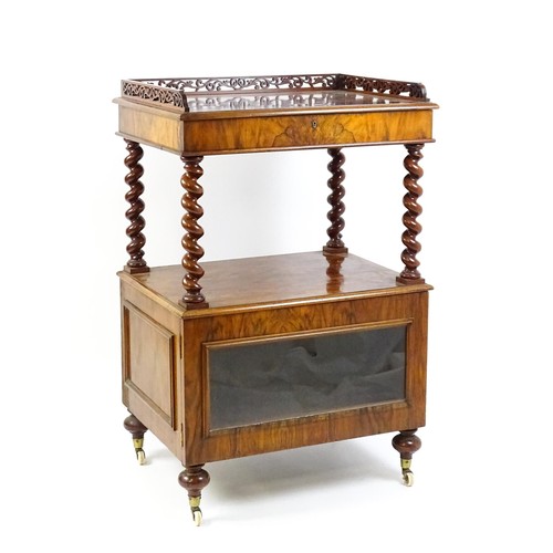 1677 - A late 19th century walnut whatnot / side cabinet surmounted by a pierced floral decorated upstand, ... 