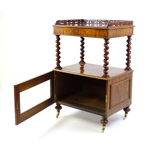 1677 - A late 19th century walnut whatnot / side cabinet surmounted by a pierced floral decorated upstand, ... 