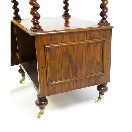 1677 - A late 19th century walnut whatnot / side cabinet surmounted by a pierced floral decorated upstand, ... 