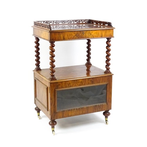 1677 - A late 19th century walnut whatnot / side cabinet surmounted by a pierced floral decorated upstand, ... 