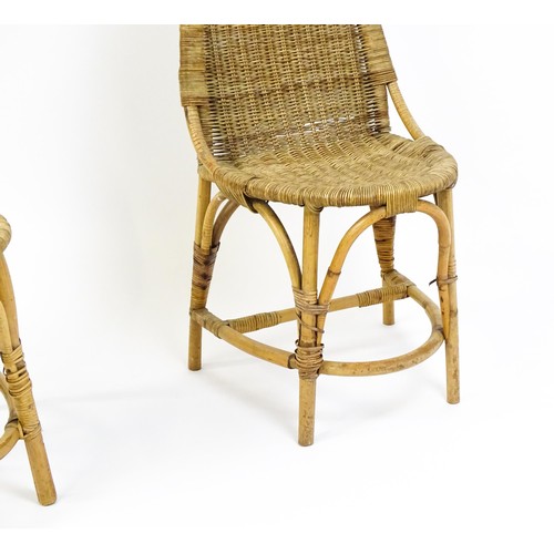 1686 - A pair of Dryad rattan side chairs with hoop handles to the top and raised on four legs with arched ... 