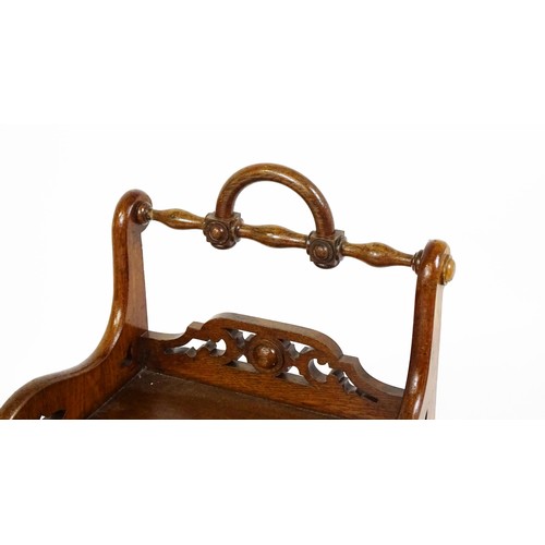 1570A - A 19thC oak Gothic hall chair with a loop handle to the top and carved roundel decoration alongside ... 