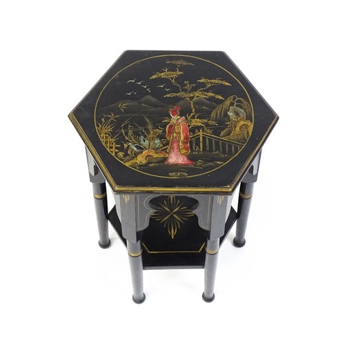 1590A - An early 20thc ebonised Moorish table with a painted hexagonal top above six turned legs with Mooris... 