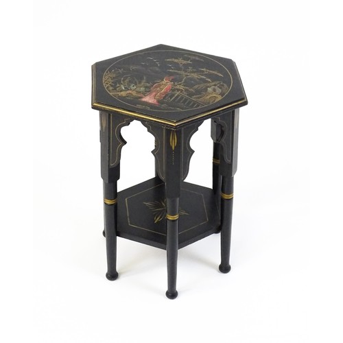 1590A - An early 20thc ebonised Moorish table with a painted hexagonal top above six turned legs with Mooris... 