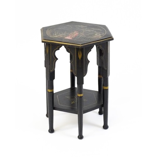 1590A - An early 20thc ebonised Moorish table with a painted hexagonal top above six turned legs with Mooris... 