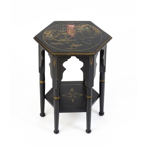 1590A - An early 20thc ebonised Moorish table with a painted hexagonal top above six turned legs with Mooris... 