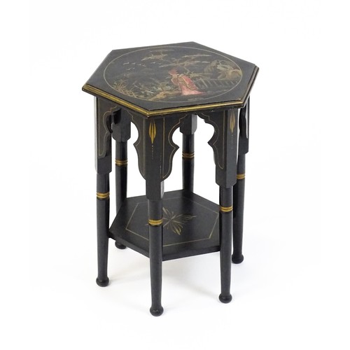 1590A - An early 20thc ebonised Moorish table with a painted hexagonal top above six turned legs with Mooris... 