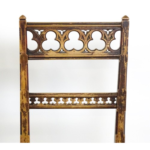 1564A - Four 19thC Gothic side chairs, the top rails having large pierced trefoil decoration and the mid rai... 