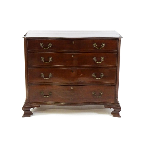 1674 - A c.1760 serpentine fronted mahogany chest of drawers with four long graduated drawers raised on oge... 