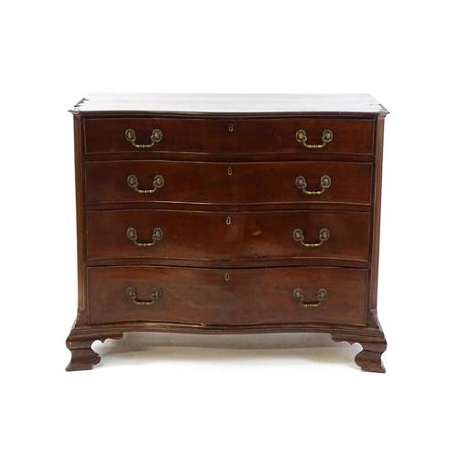 1674 - A c.1760 serpentine fronted mahogany chest of drawers with four long graduated drawers raised on oge... 