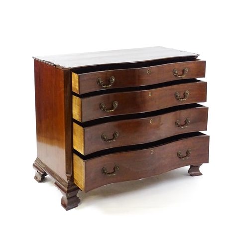 1674 - A c.1760 serpentine fronted mahogany chest of drawers with four long graduated drawers raised on oge... 