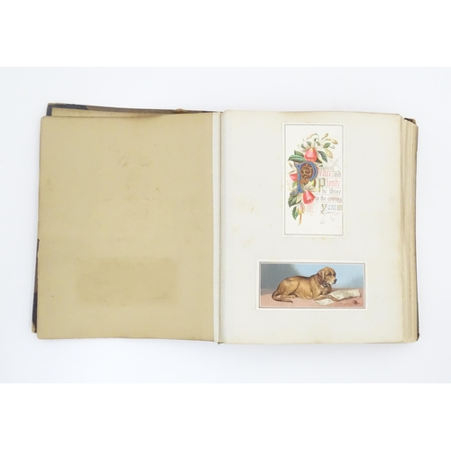 2137 - A Victorian scrapbook / scrap album containing various greetings cards to include Christmas Greeting... 