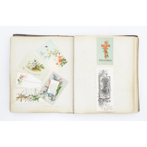 2137 - A Victorian scrapbook / scrap album containing various greetings cards to include Christmas Greeting... 