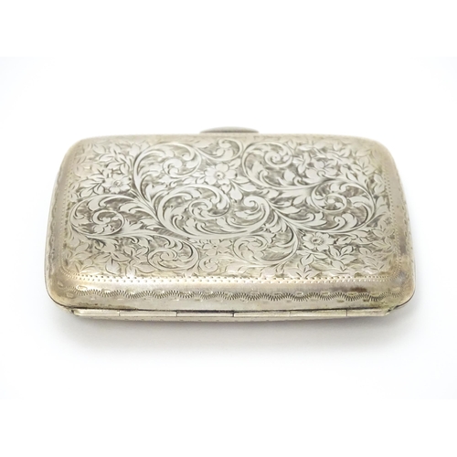 629 - A silver cigarette case and vesta case with engraved acanthus decoration, hallmarked Birmingham 1906... 