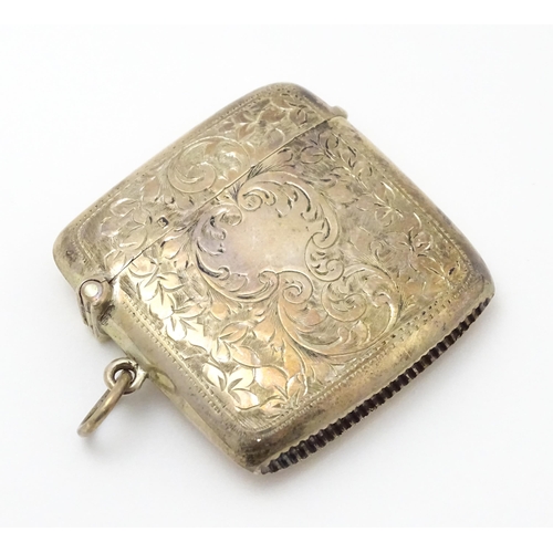 629 - A silver cigarette case and vesta case with engraved acanthus decoration, hallmarked Birmingham 1906... 