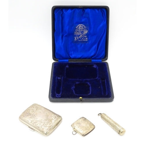 629 - A silver cigarette case and vesta case with engraved acanthus decoration, hallmarked Birmingham 1906... 