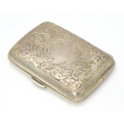 629 - A silver cigarette case and vesta case with engraved acanthus decoration, hallmarked Birmingham 1906... 