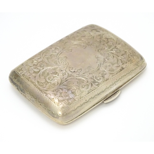 629 - A silver cigarette case and vesta case with engraved acanthus decoration, hallmarked Birmingham 1906... 