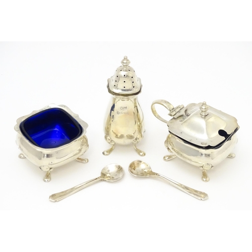 636 - A cased three piece silver cruet set comprising pepper, salt and mustard pot, hallmarked Birmingham ... 