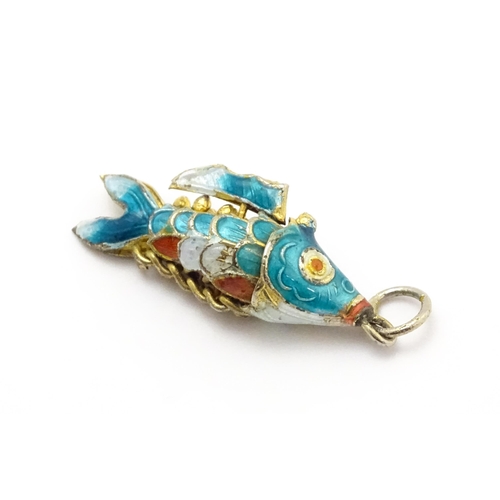 764A - A pendant formed as an articulated fish with enamel detail. Approx 1 1/4