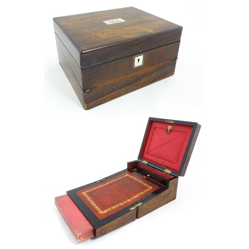 1286 - A Victorian rosewood workbox with inlaid mother of pearl escutcheon and plaque to top, opening to re... 