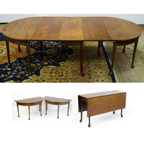 1531 - A 19thC mahogany D - end dining table comprised of two demi lune tables and a drop flap table raised... 