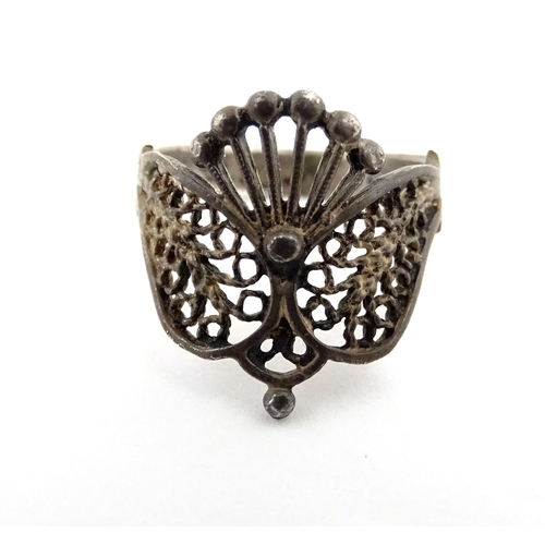 910A - A quantity of assorted jewellery comprising a Continental silver ring with filigree decoration, a wh... 