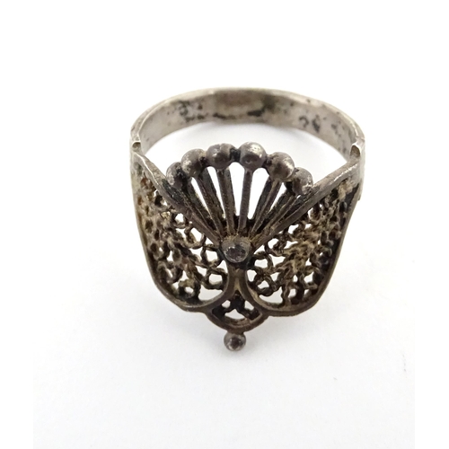 910A - A quantity of assorted jewellery comprising a Continental silver ring with filigree decoration, a wh... 