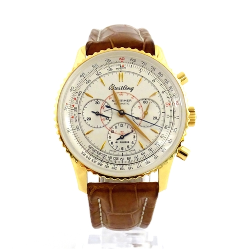 An 18ct gold cased gentleman's Breitling Navitimer Montbrillant automatic chronograph wristwatch, the silvered dial hour batons and three subsidiary dials, with leather strap having 18ct gold buckle. Ref. H30030.1, no. 810. Watch case approx. 1 1/2" wide. With box and paperwork