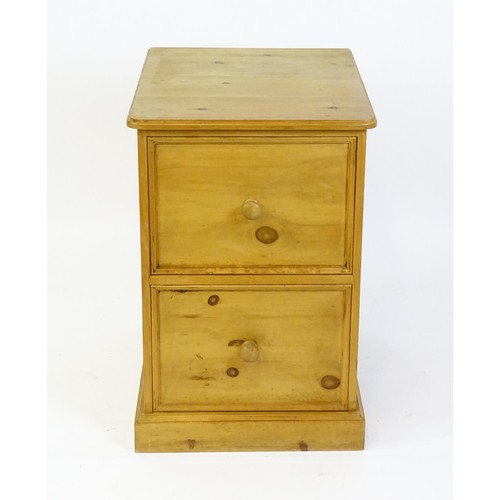 22 - A late 20thC pine filing cabinet. 28