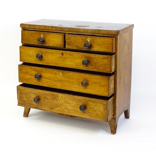 27 - A 19thC mahogany chest of drawers comprising two short over three long drawers with turned knob hand... 