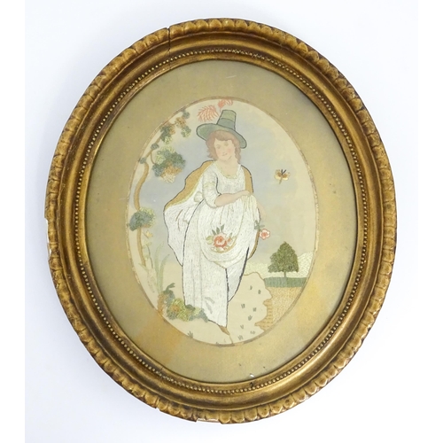 45 - A 19thC needlework embroidery on silk depicting a young lady with flowers in a landscape. Approx. 9