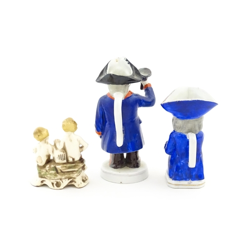 50 - Three assorted ceramic figures to include a Toby / character jug modelled as a seated man wearing a ... 