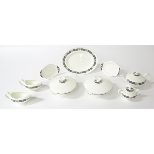 74 - A quantity of Wedgwood dinner wares in the Asia pattern to include plates, twin handled soup bowls, ... 