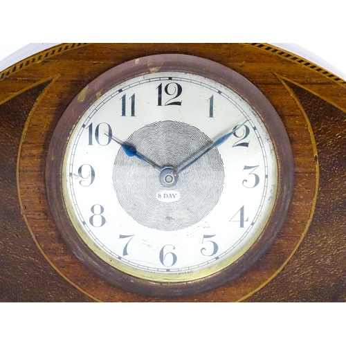 66 - A German 8-day mahogany cased mantel clock with inlaid detail to case. Approx 5 1/4