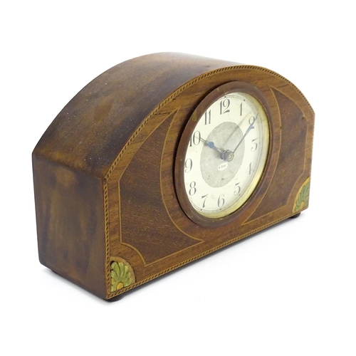 66 - A German 8-day mahogany cased mantel clock with inlaid detail to case. Approx 5 1/4