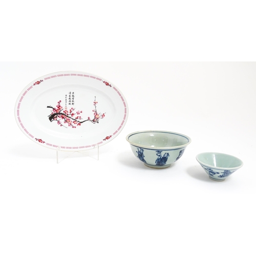 105 - Three Oriental items comprising a blue and white bowl decorated with the eight immortals, a sake bow... 