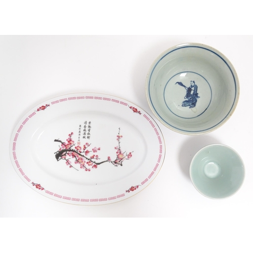 105 - Three Oriental items comprising a blue and white bowl decorated with the eight immortals, a sake bow... 